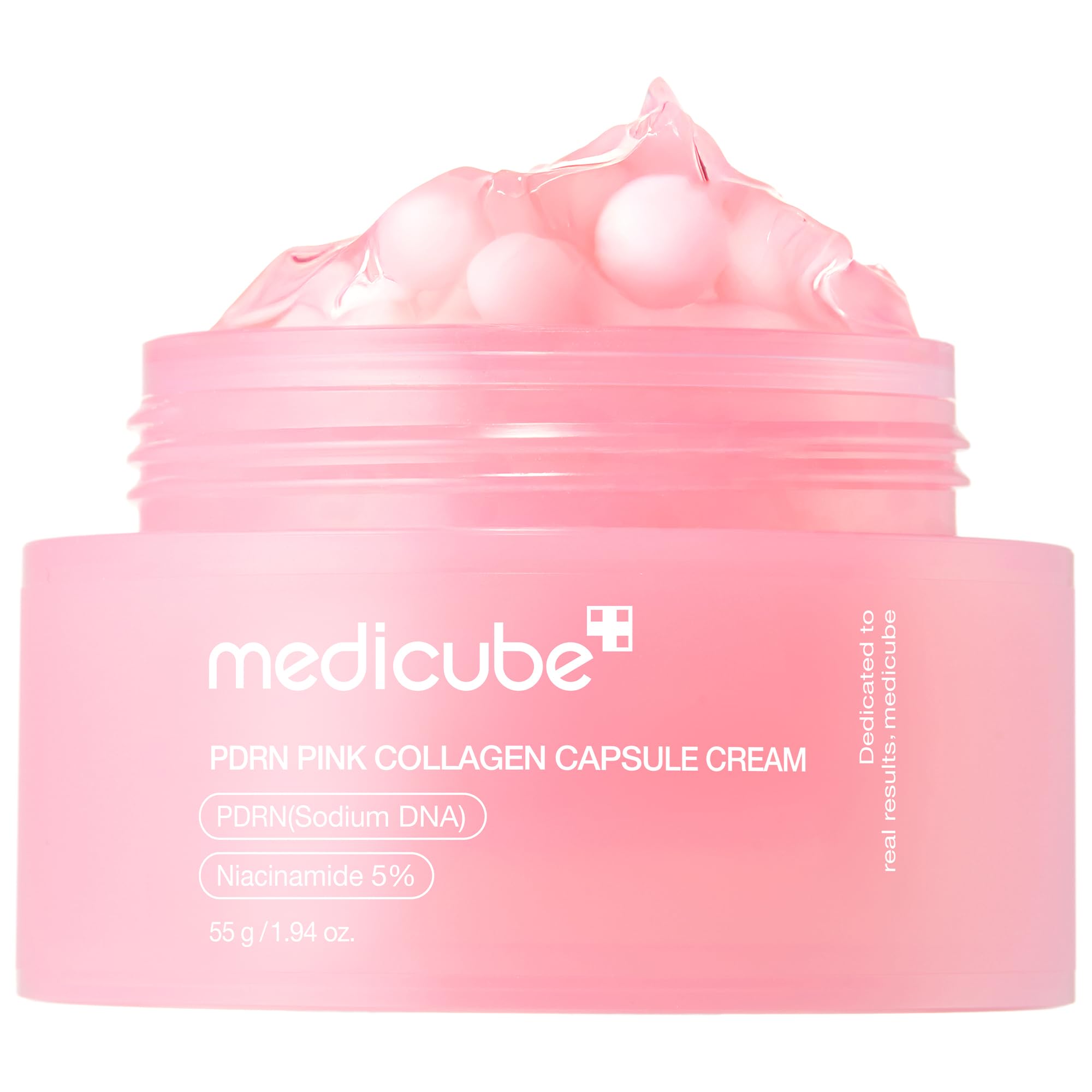 Medicube Salmon DNA PDRN pink capsules close-up for hydration and glow.
