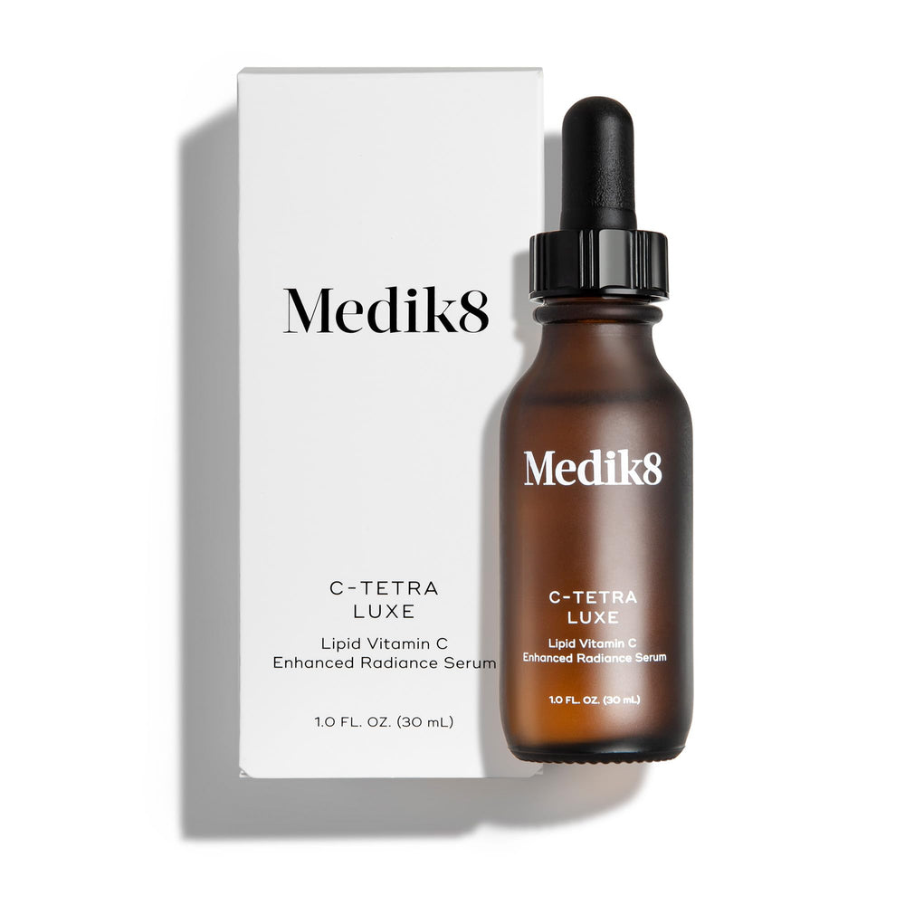 Medik8 C-Tetra Luxe bottle close-up showcasing vitamin C serum for radiant skin.