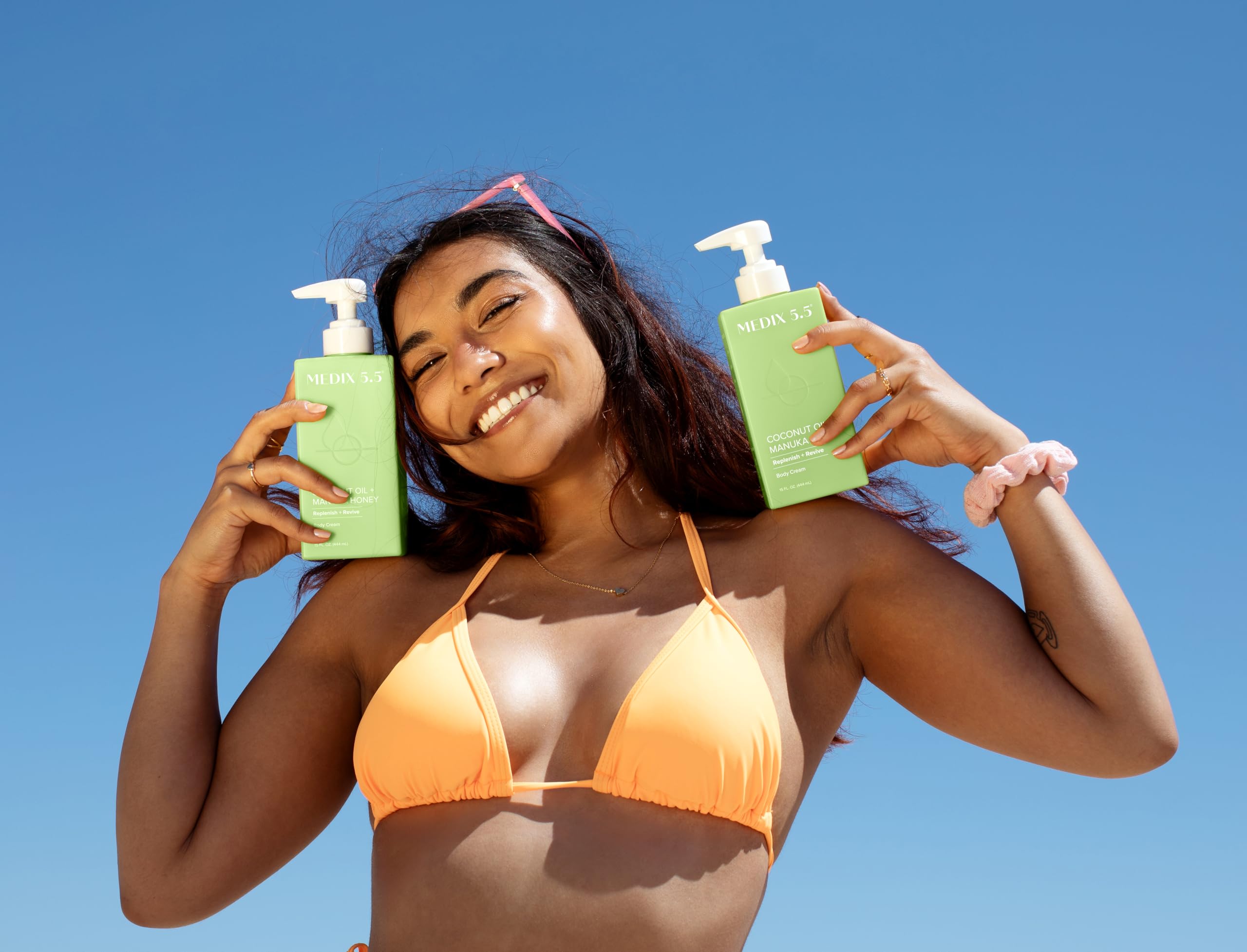 Medix 5.5 coconut oil lotion on skin shows fast absorption for a smooth finish.