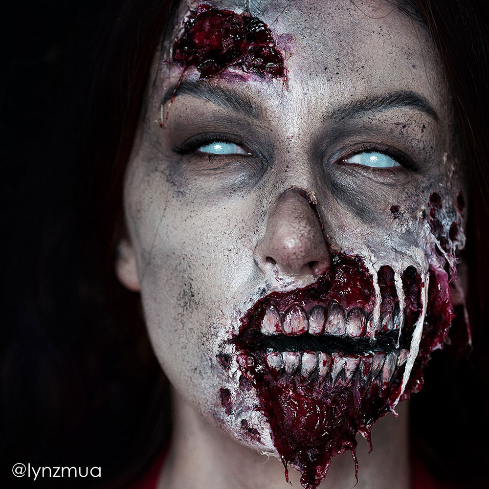 Mehron Liquid Latex layered with cotton tissue to build scar texture.