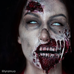 Mehron Liquid Latex layered with cotton tissue to build scar texture.