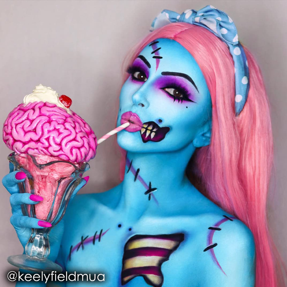 Mehron Paradise AQ light blue face paint application on the cheek for cosplay.