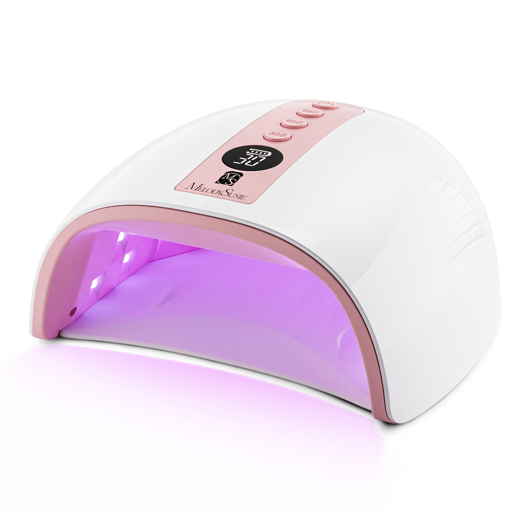 MelodySusie cordless UV nail lamp P-Plus30G pink on desk enables fast home gel curing.