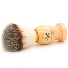 Menesia brush bristle detail shows nylon fibers for gentle skin contact.
