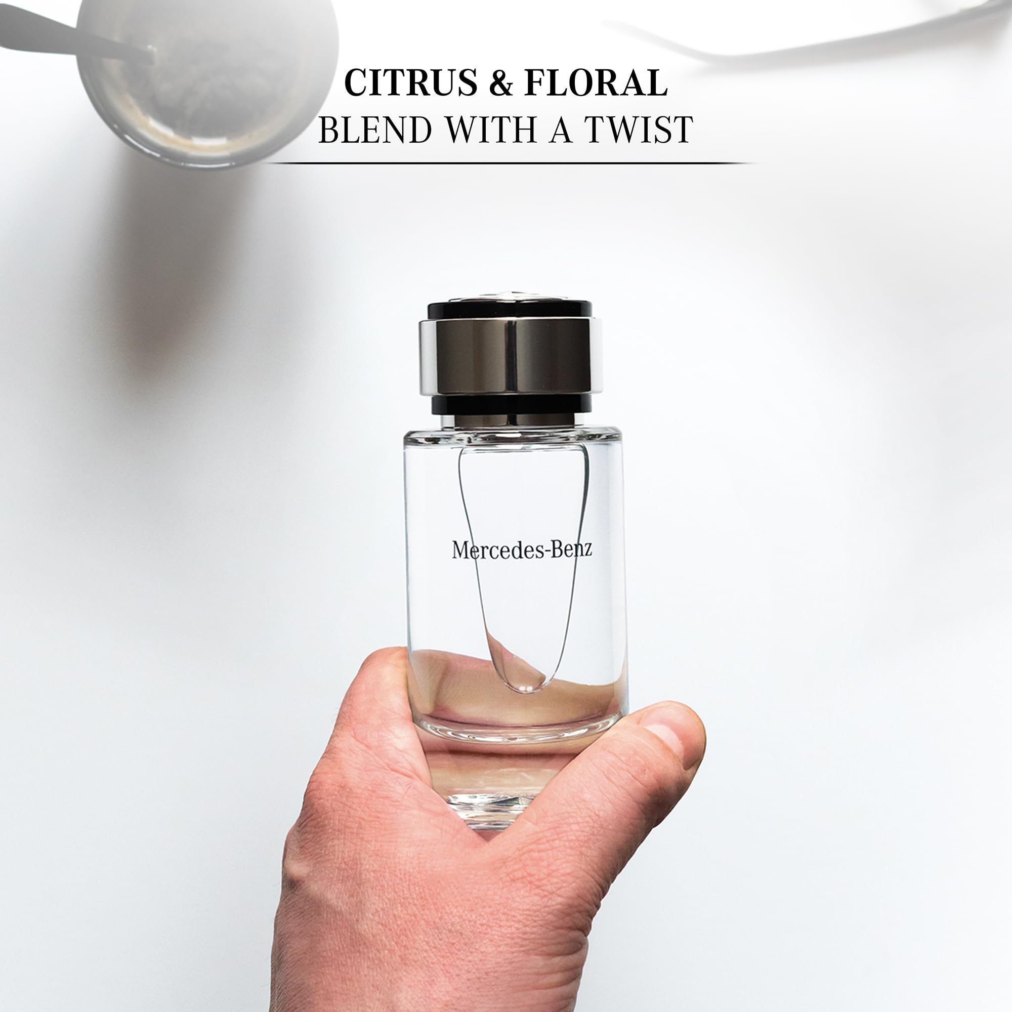 Mercedes-Benz Cologne for Men liquid in glass shows a bright citrus opening and smooth dry-down.