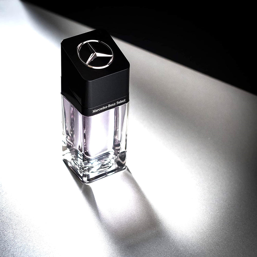 Mercedes-Benz Select bottle on desk with blue accents conveys luxury and confidence