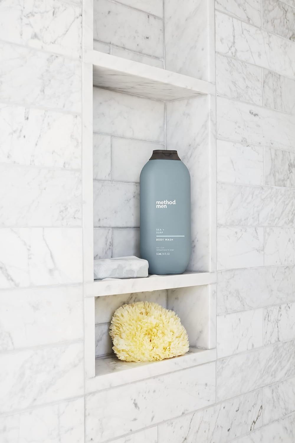 Method Men Body Wash earthy fragrance shot evokes calming, nature-inspired scent.