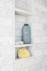 Method Men Body Wash earthy fragrance shot evokes calming, nature-inspired scent.