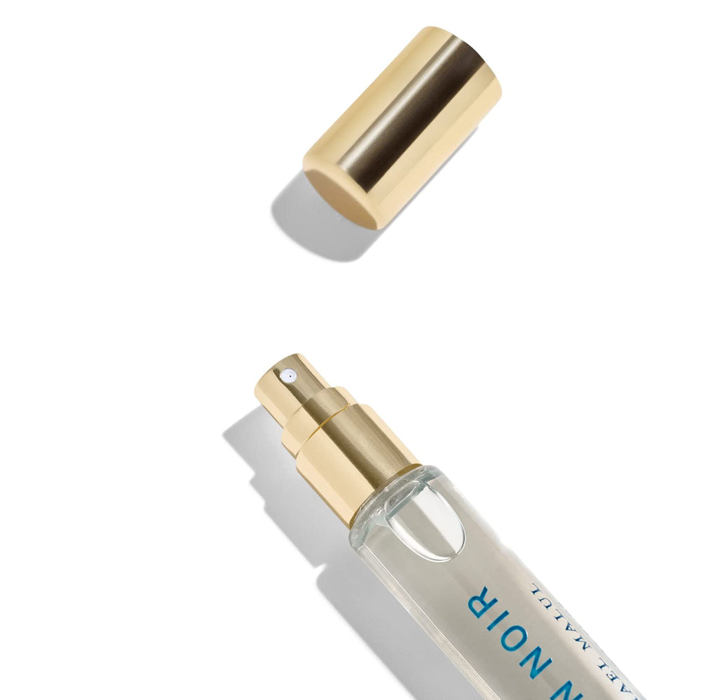 Travel-size 10ml Ocean Noir showcased; portability supports spontaneous evenings away from home.