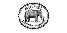 Michel Design Works hand soap bottle with signature medallion emphasizes elegant packaging and premium hand cleansing ritual.