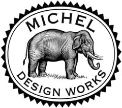 Michel Design Works Winterberry Balsam hand soap bottle in a caddy suggests elegant sink companion