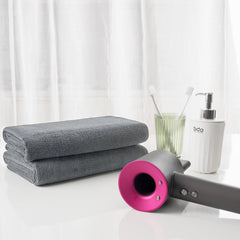 Microfi microfiber hair-drying towels gray pack folded on towel rack.