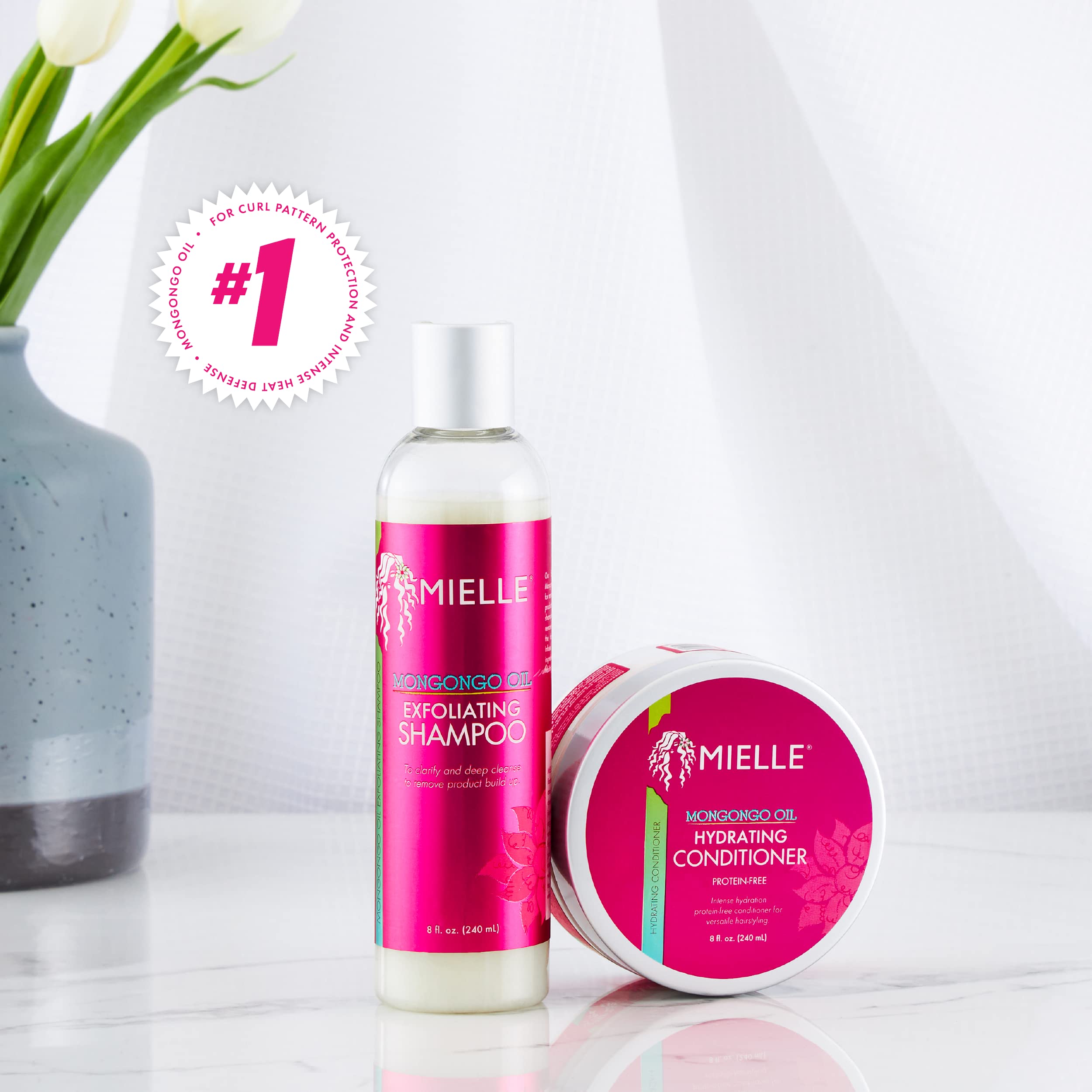 Envase de 8 onzas de Mongongo Exfoliating Shampoo listo para uso regular.