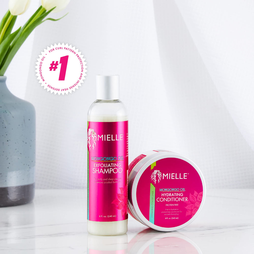 Mielle Organics Mongongo Oil Exfoliating Shampoo on wet hair demonstrates cleansing without stripping moisture.