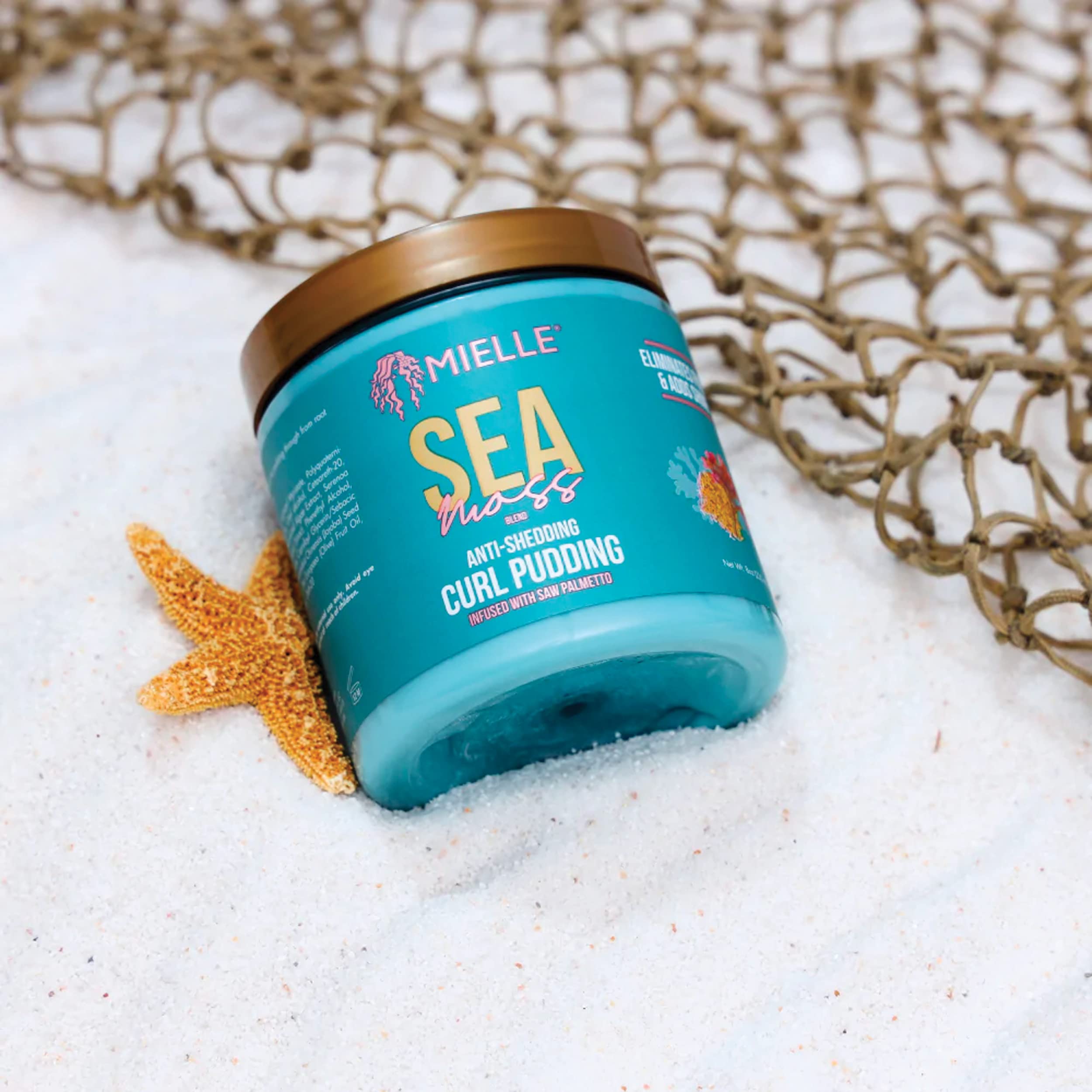 Mielle Organics Sea Moss Curl Pudding application on natural hair texture.