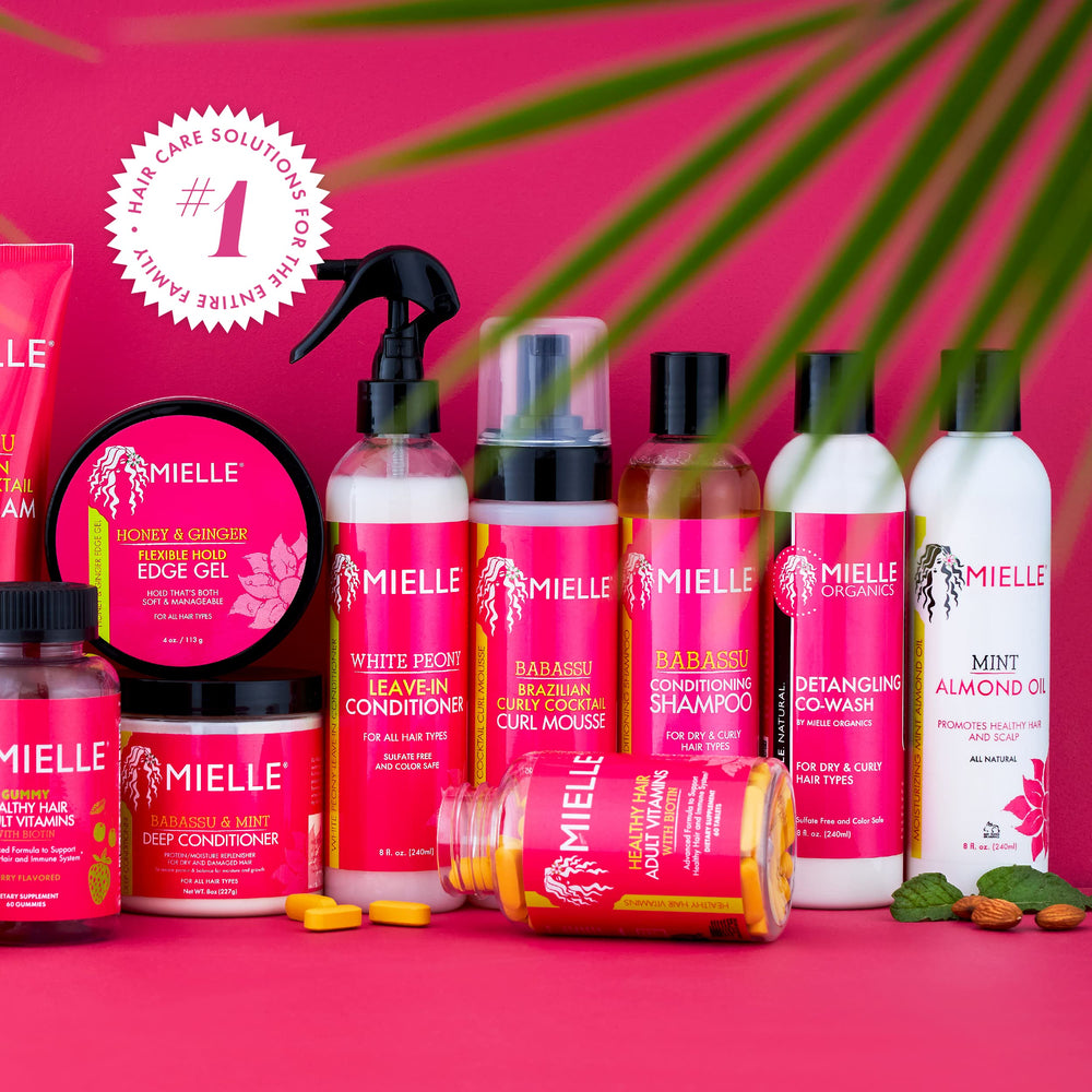 Mielle Organics White Peony Leave-In on hair showing reduced frizz and shine.