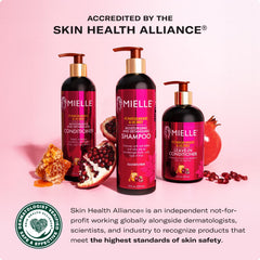 Mielle Pomegranate & Honey leave-in ingredients closeup with babassu oil and citrus