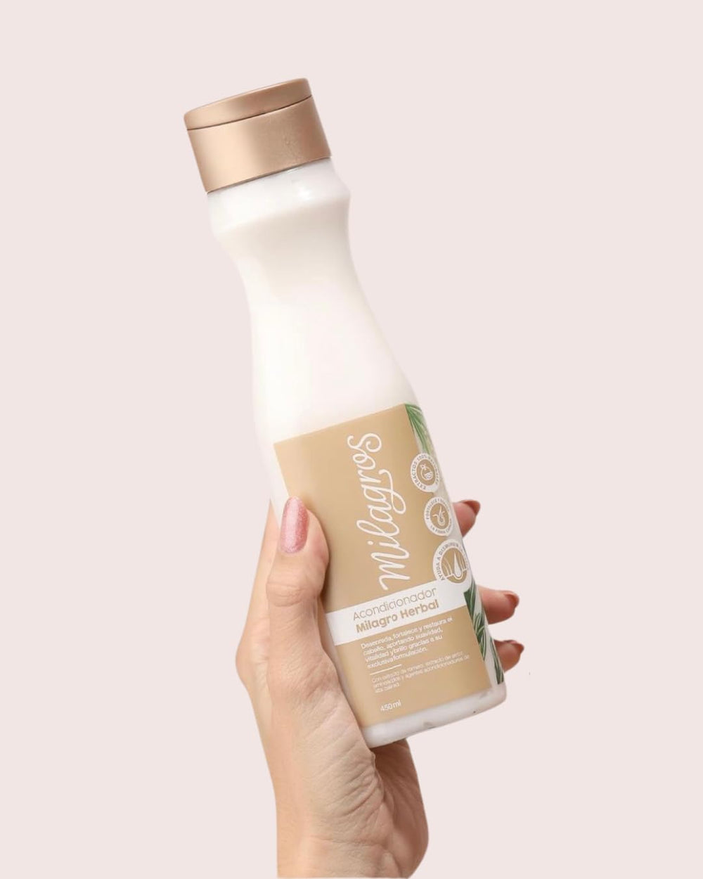 Milagros Herbal Conditioner tube close-up emphasizing smoothing and detangling benefits.