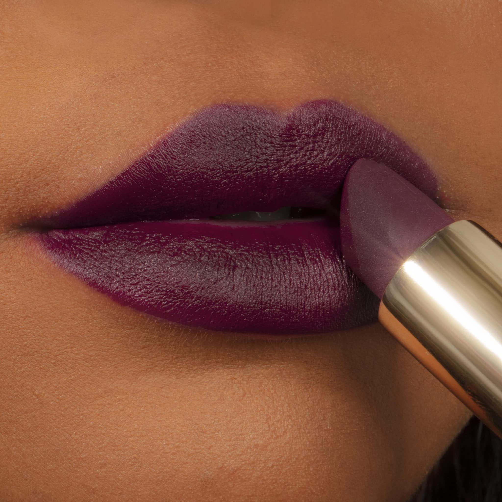 Milani Color Fetish Matte Lipstick Dahlia swatch on lips shows full-coverage look