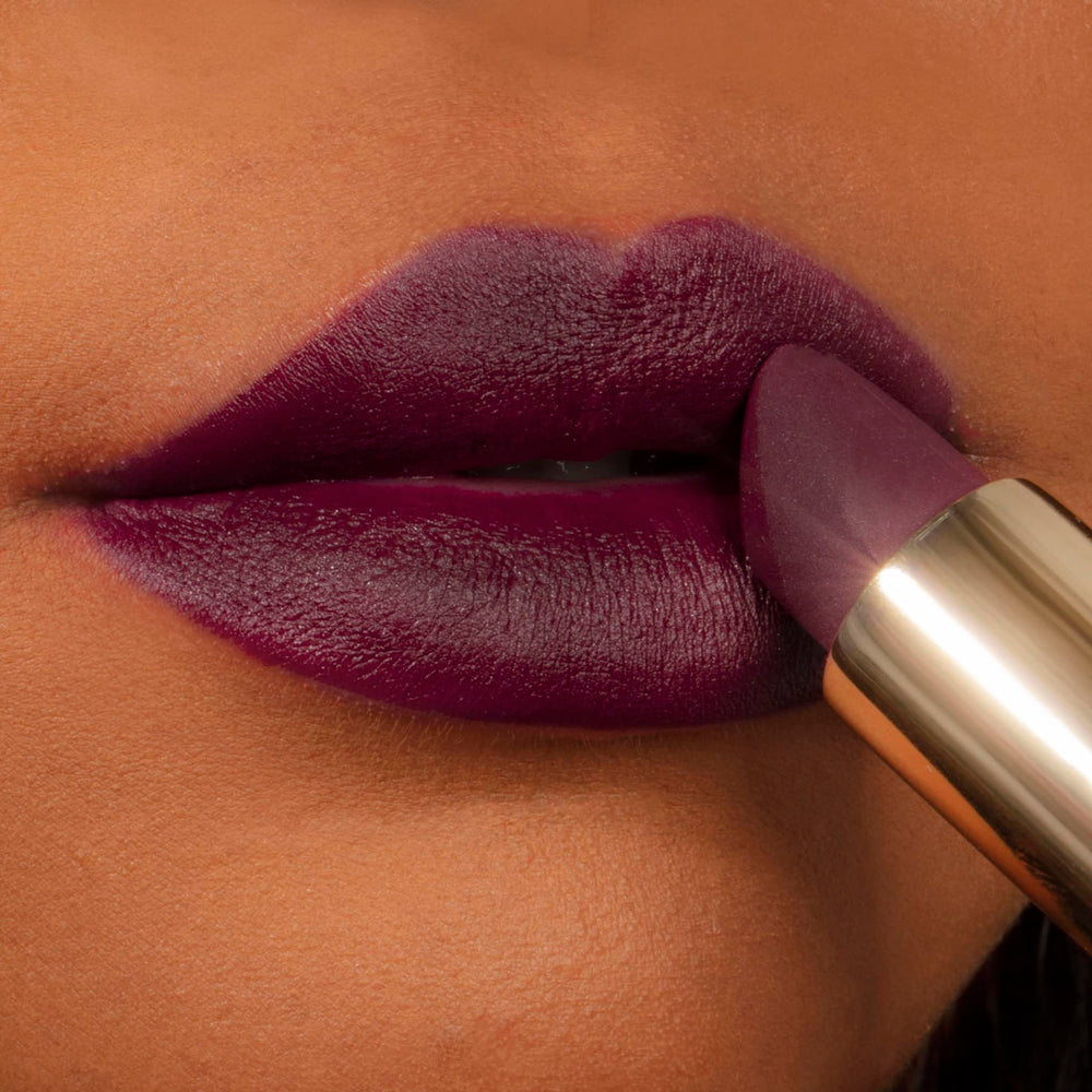 Milani Color Fetish Matte Lipstick Dahlia swatch on lips shows full-coverage look
