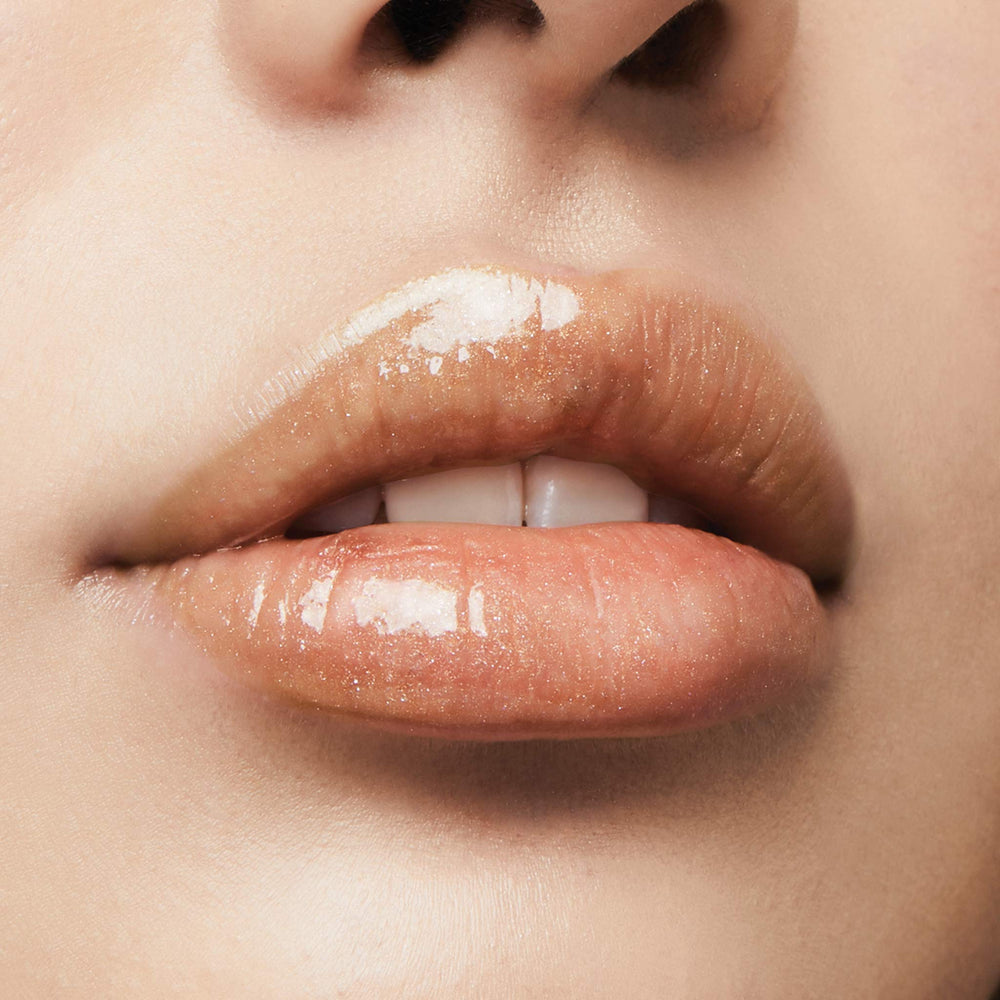 Milani Lip Gloss Keep It Full 16-shades display shows versatile color range.
