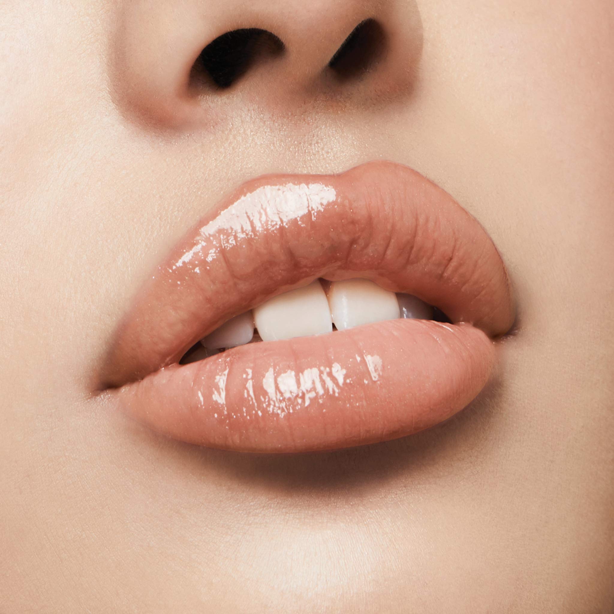 Milani Keep It Full Champagne non-sticky formula in action on lips.