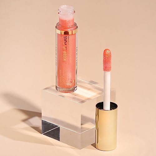 Milani Keep It Full Champagne gloss on lips with subtle shine.