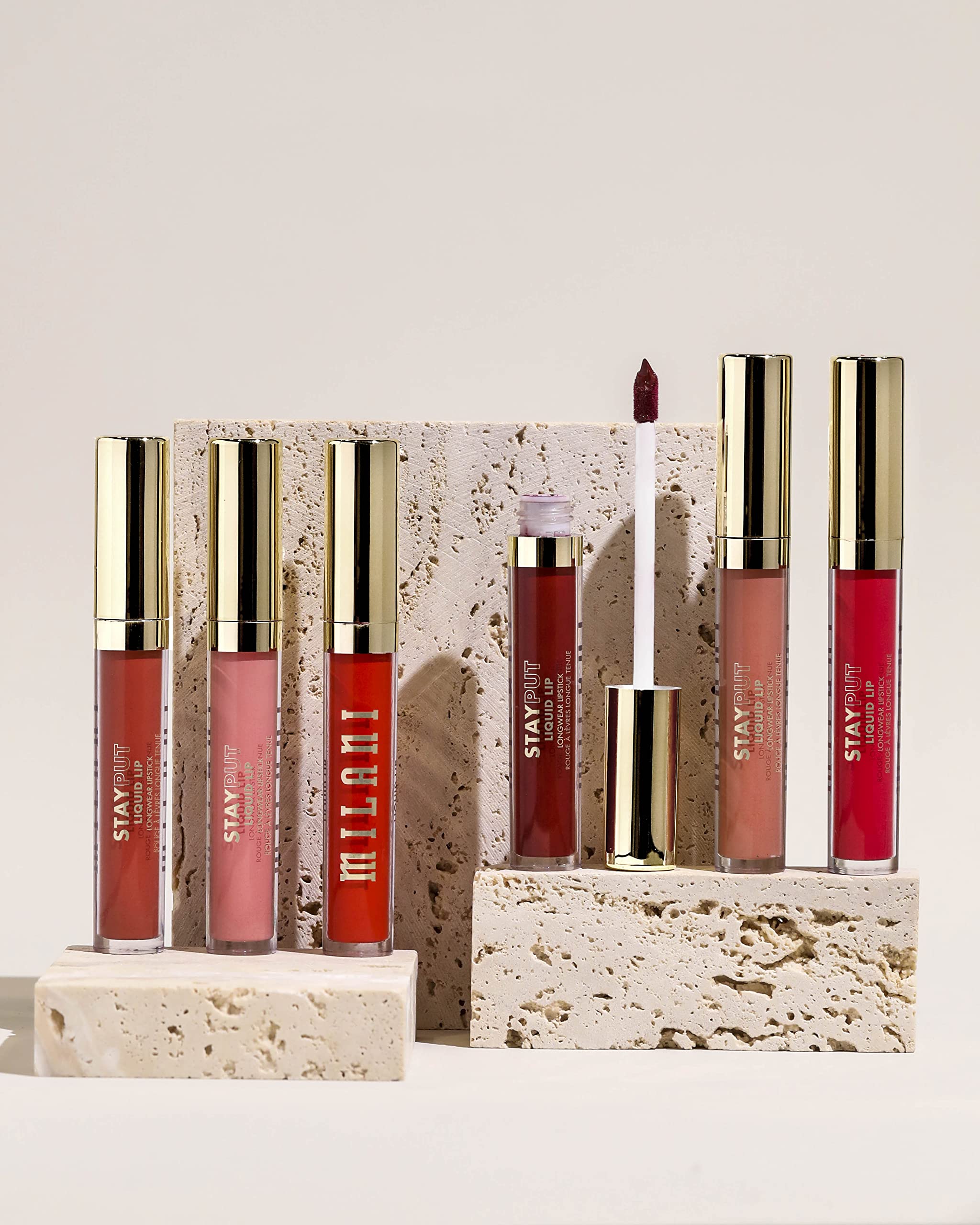 Milani Stay Put Lipstick smudge-proof test on lips demonstrates long wear.