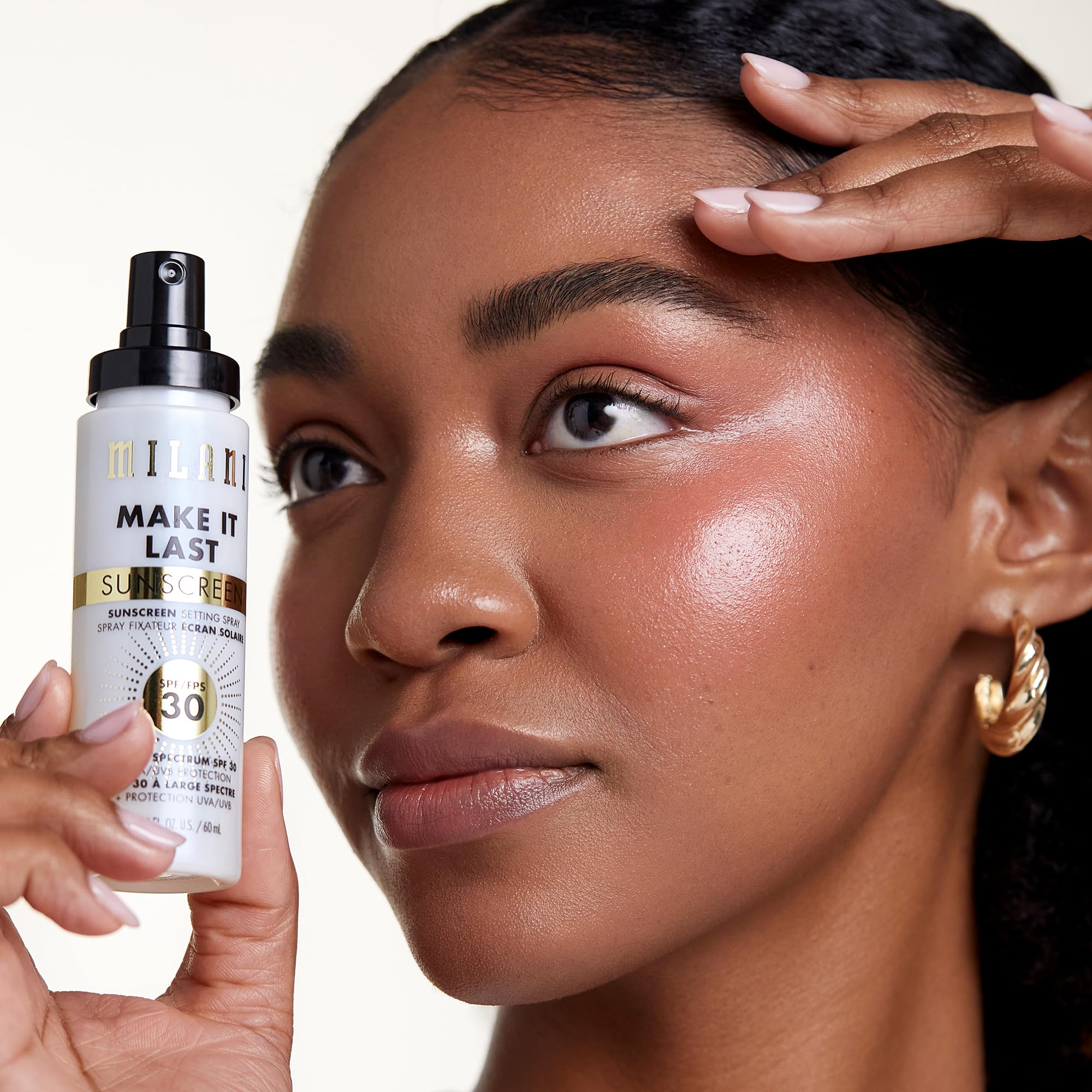 Milani setting spray demonstrated spraying at a distance for even application.