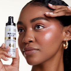 Milani setting spray demonstrated spraying at a distance for even application.