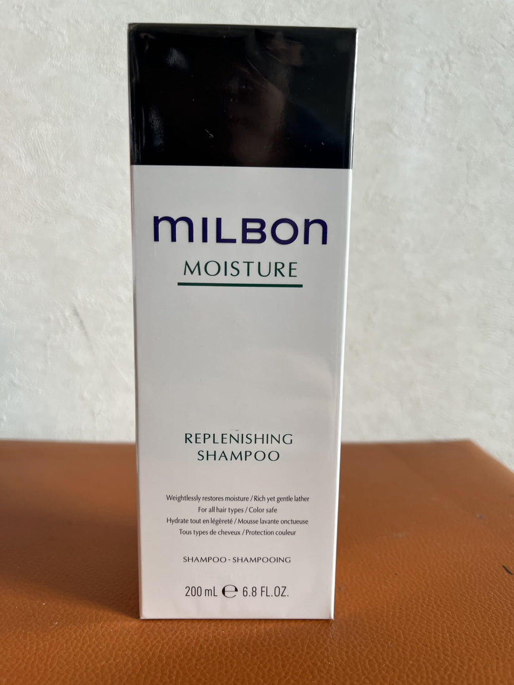 Milbon Moisture Replenishing Shampoo bottle shows hydrating care for dry hair.