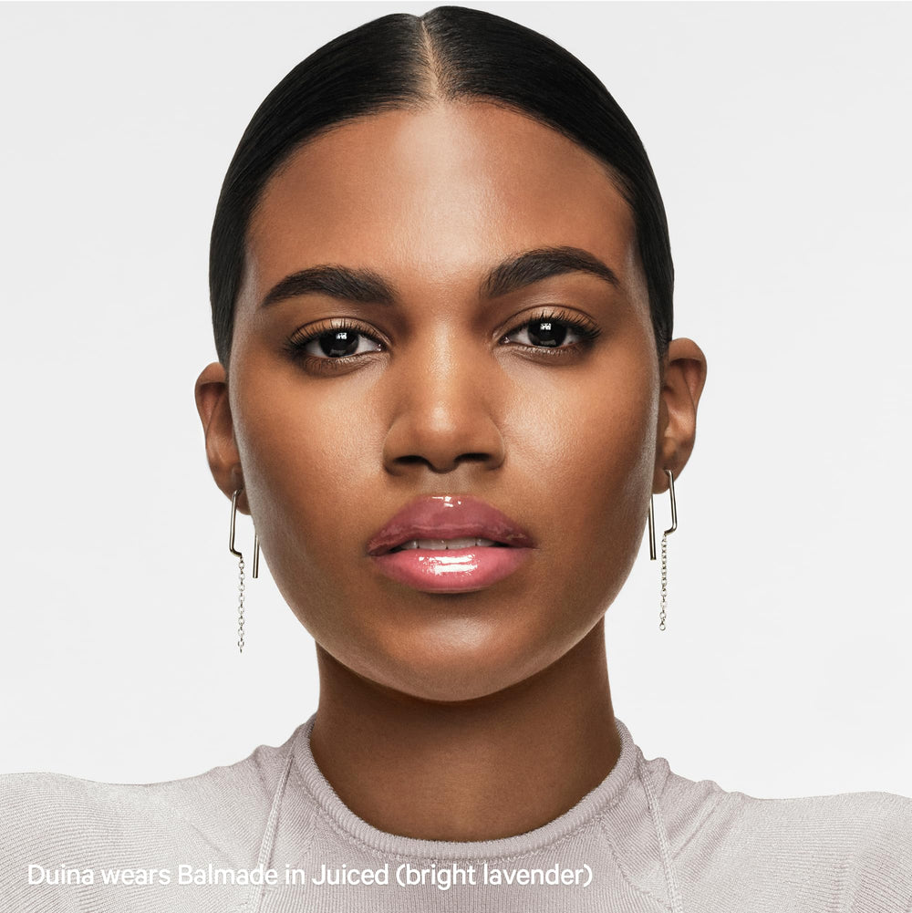 Milk Makeup Balmade Electrolyte Lip Balm twist-up applicator in use.