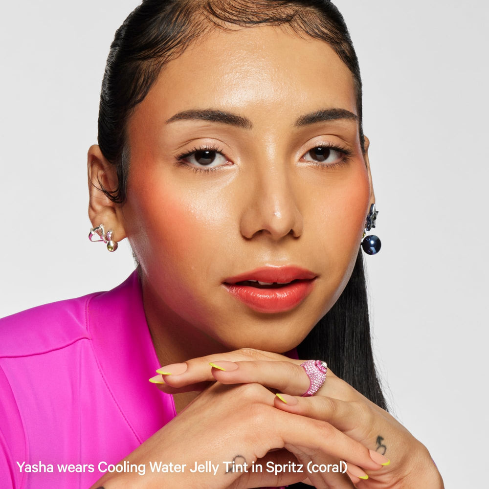 Milk Makeup Jelly Tint coral shade swatch on lips for warm sunset glow.