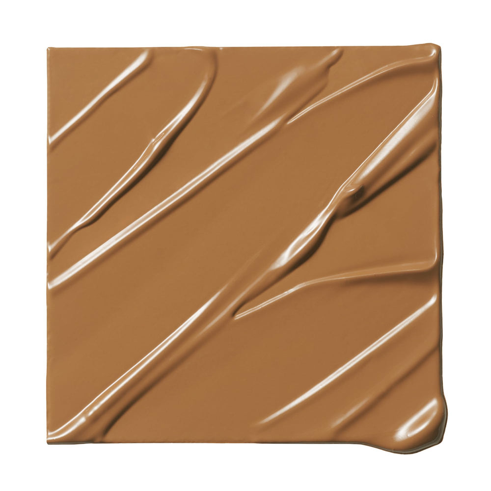 Milk Makeup Future Fluid Concealer 21W swatches show deep warm undertones for natural concealment.