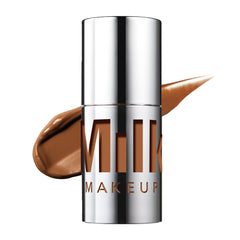 Milk Makeup Future Fluid Concealer 24N shade deep neutral for even coverage.