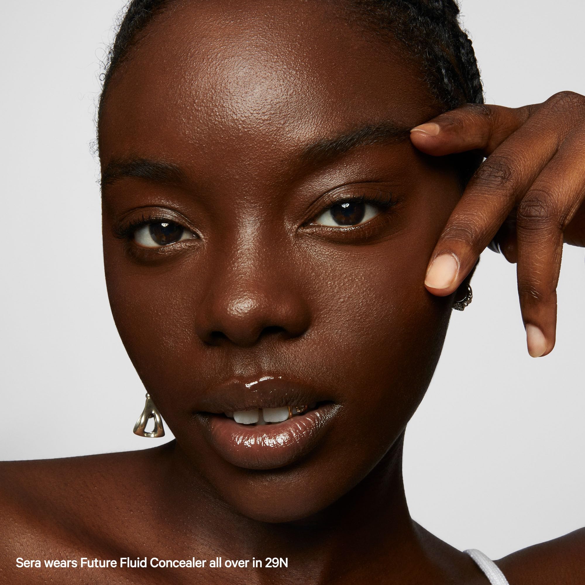 Milk Makeup Future Fluid concealer 29N cream texture on skin highlighting hydration