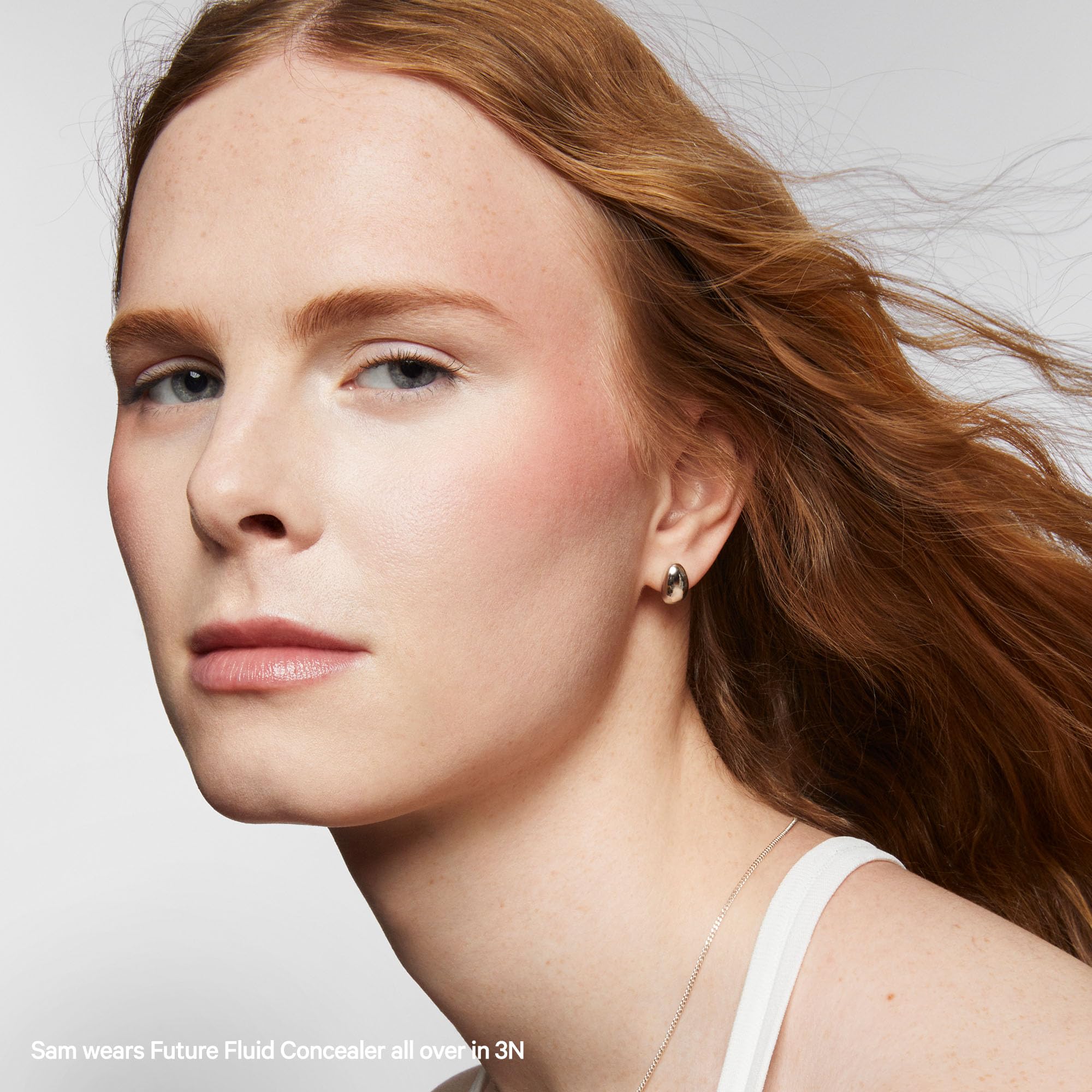 Face swatch of Milk Makeup Future Fluid Concealer 3N showing natural finish.