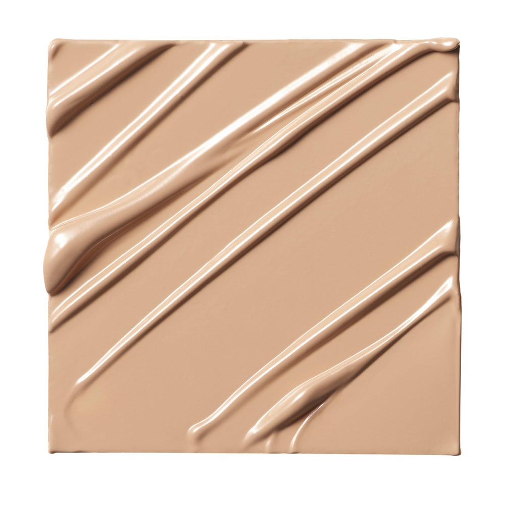 Milk Makeup Future Fluid concealer application swatch demonstrating buildable coverage.