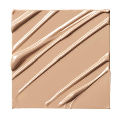 Milk Makeup Future Fluid concealer application swatch demonstrating buildable coverage.