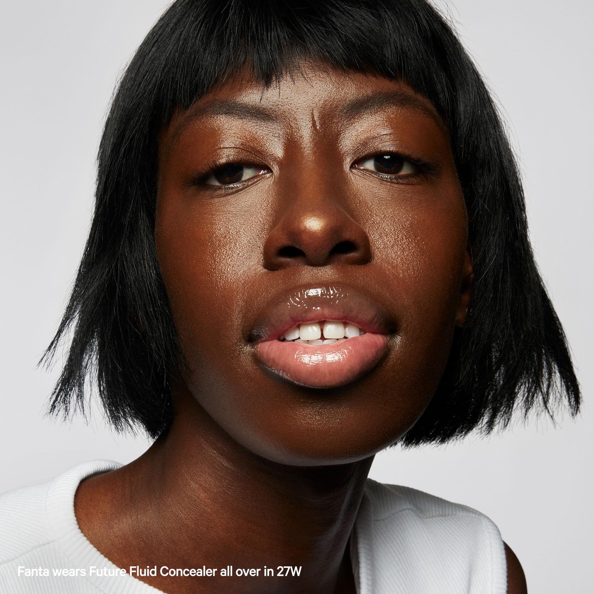 Milk Makeup Future Fluid concealer applied on the face for even tone.