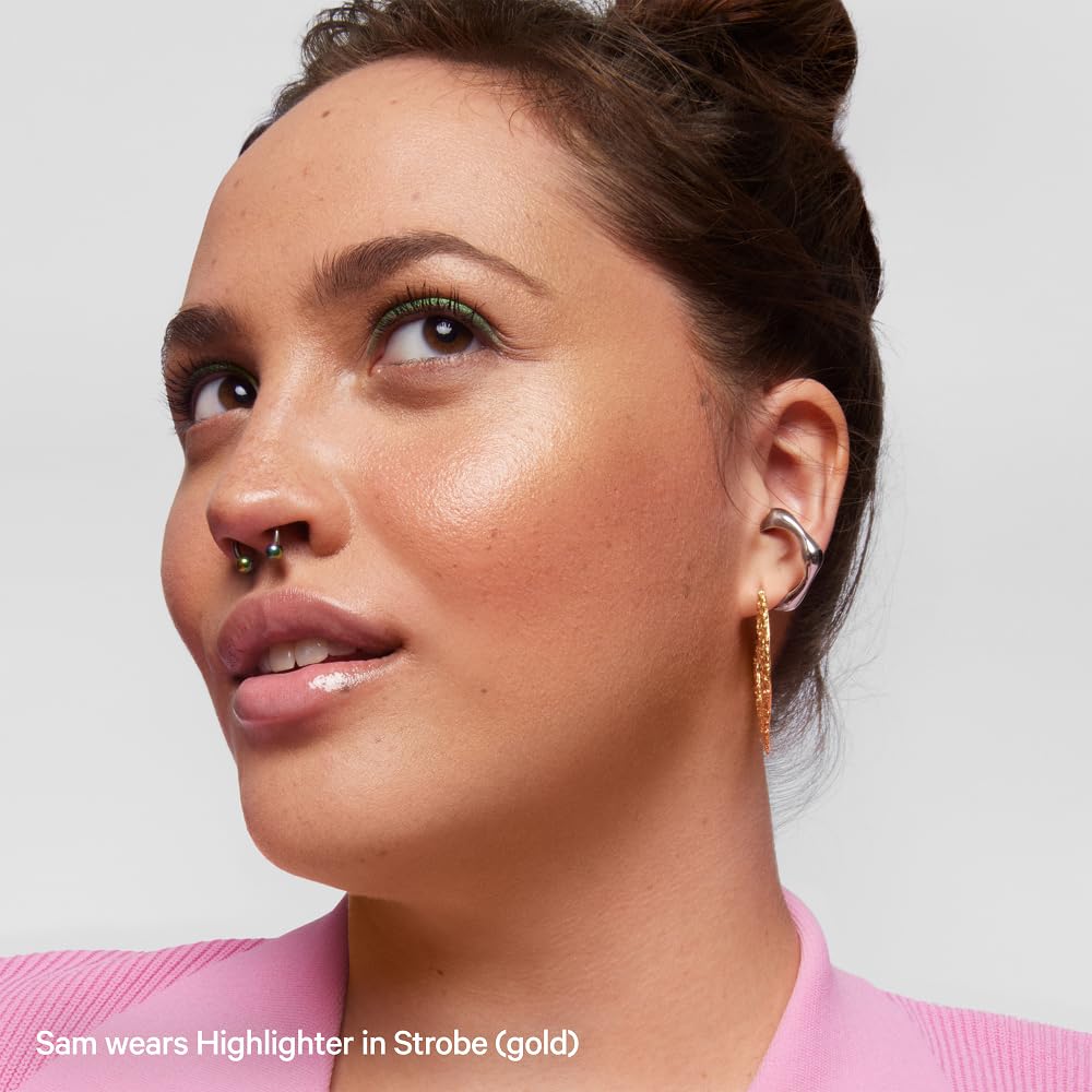 Milk Makeup Highlighter on collarbones for a luminous body glow.