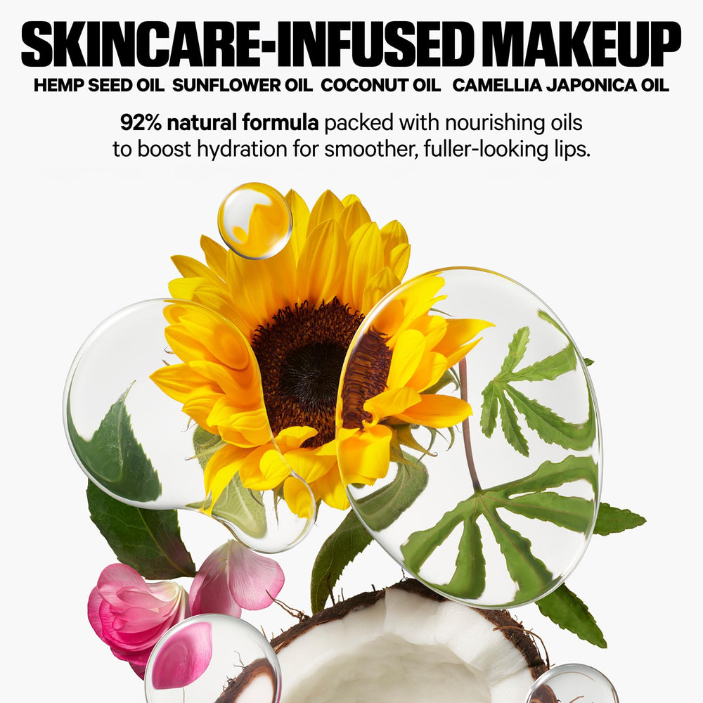 Applying Milk Makeup KUSH Cookie Dough for sheer color and shine on lips