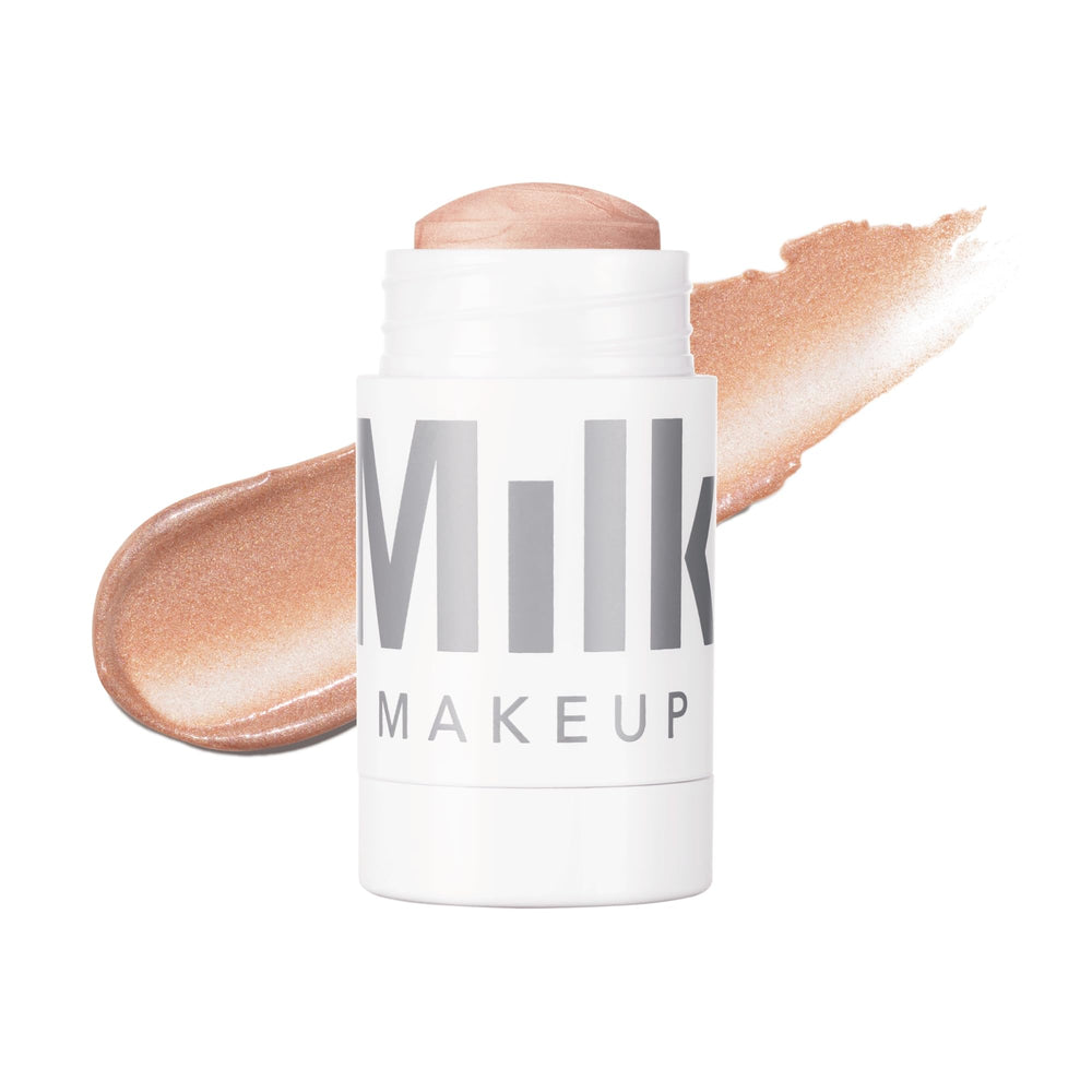 Milk Makeup Lit champagne glow on cheekbones for radiant highlight.