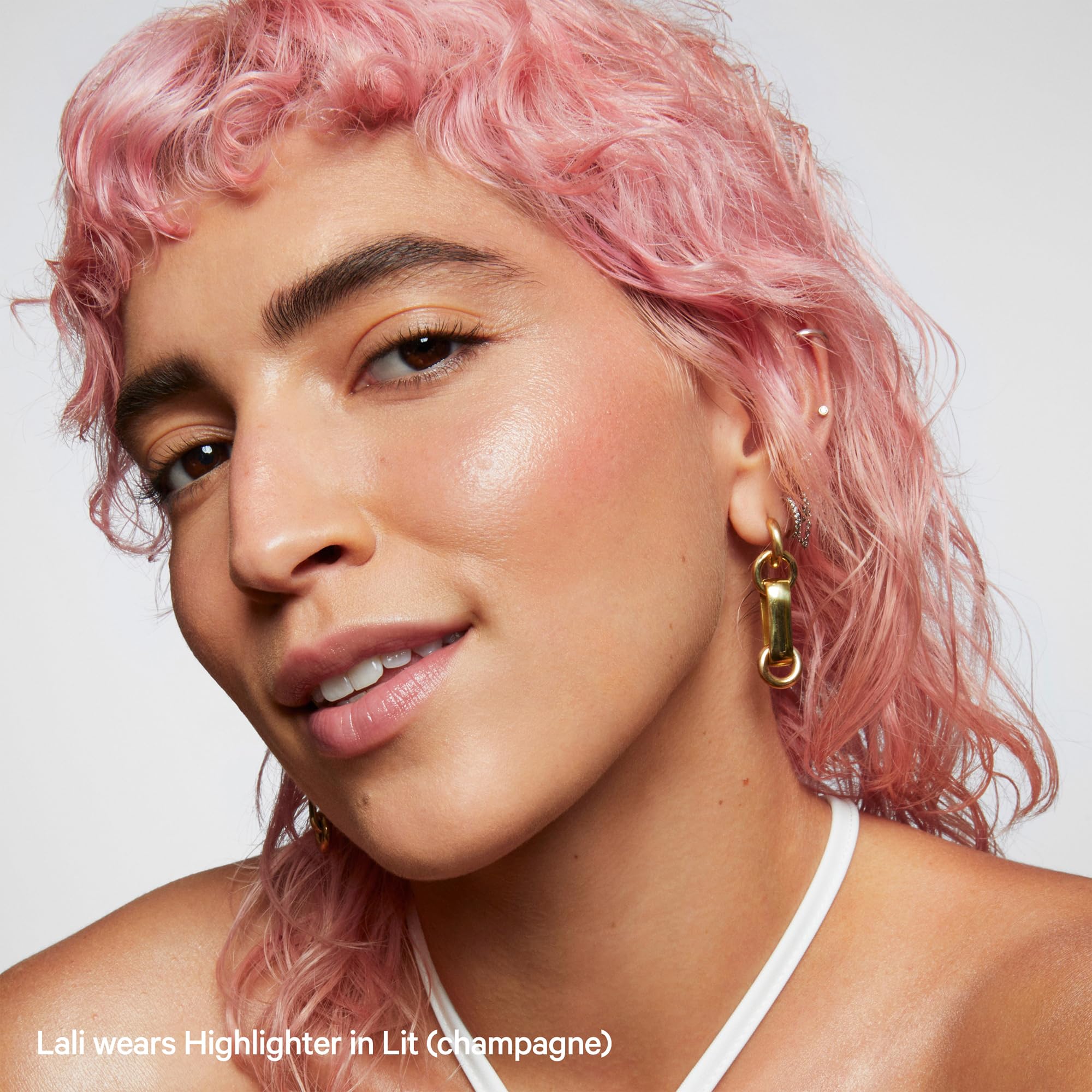 Milk Makeup Lit glow on shoulders for a dewy décolleté.