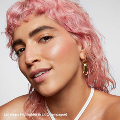 Milk Makeup Lit glow on shoulders for a dewy décolleté.