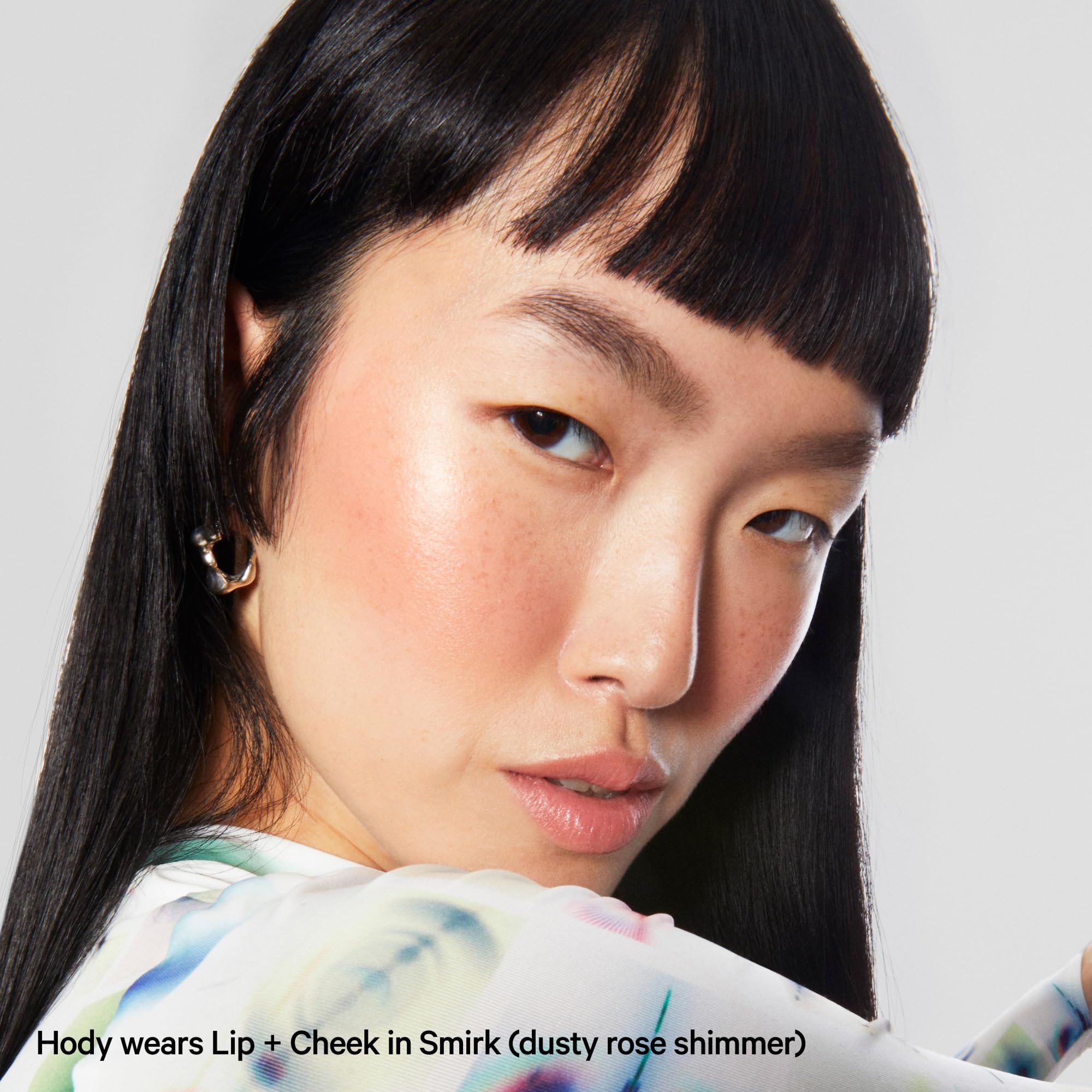 Milk Makeup Smirk shade close-up on skin with subtle shimmer