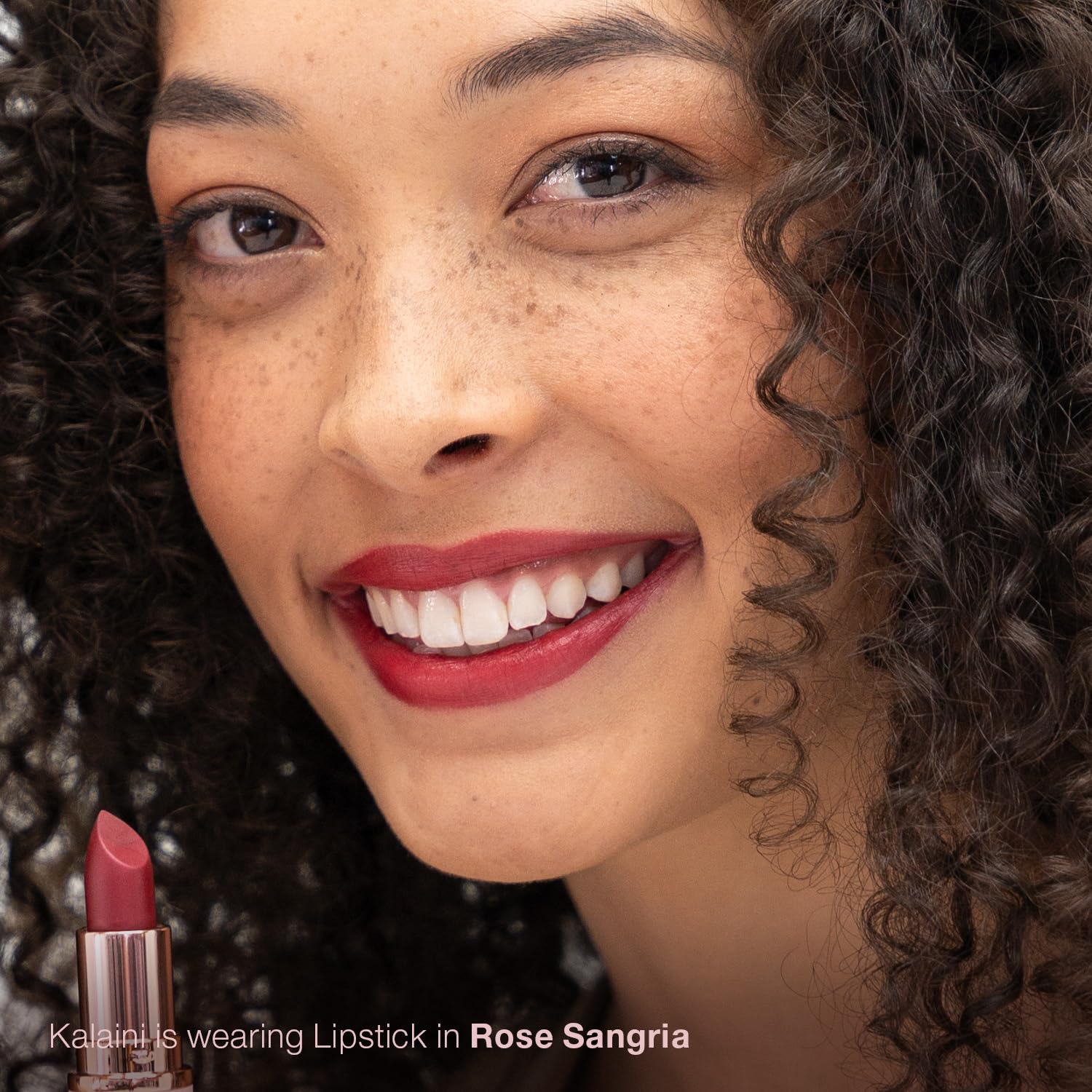 Mineral Fusion Rose Sangria application on smile demonstrates smooth glide and hydration.