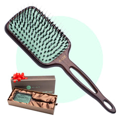 Mint boar-bristle paddle brush for gentle detangling and natural oil distribution.