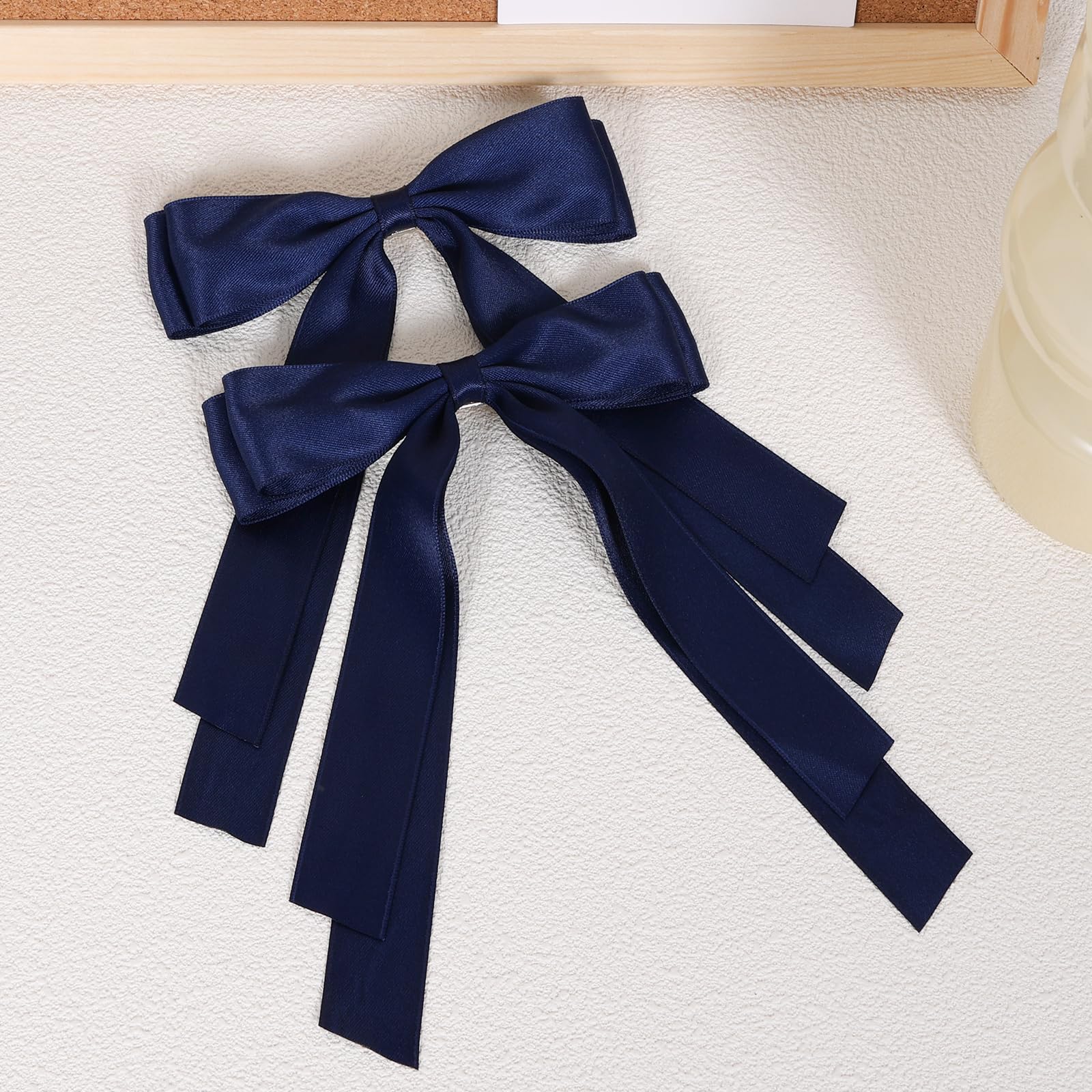 Miroksh long-tail bow clip close-up highlights graceful tassels perfect for formal styles.