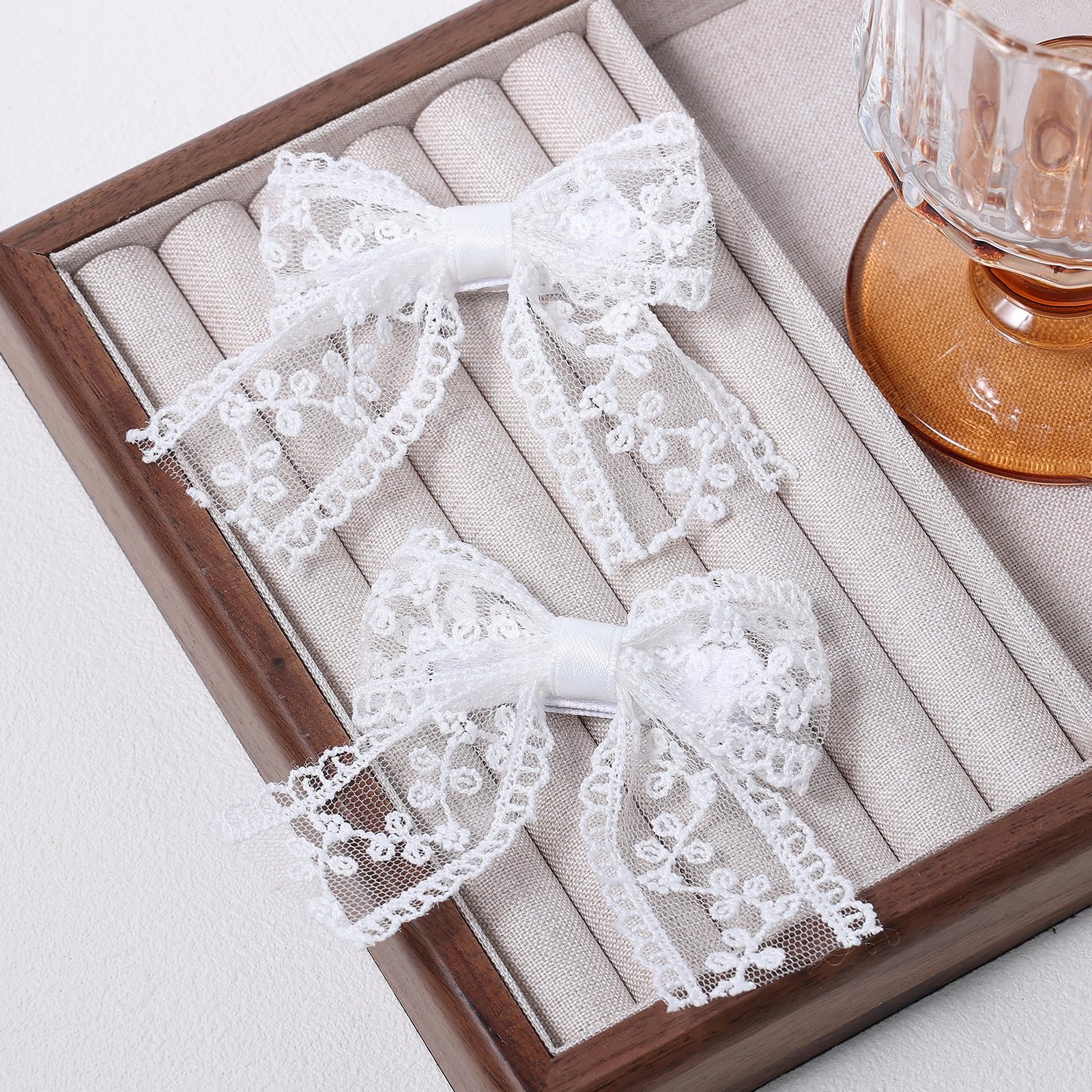 Miroksh lace bow outfit accessory versatile with dresses and bags.